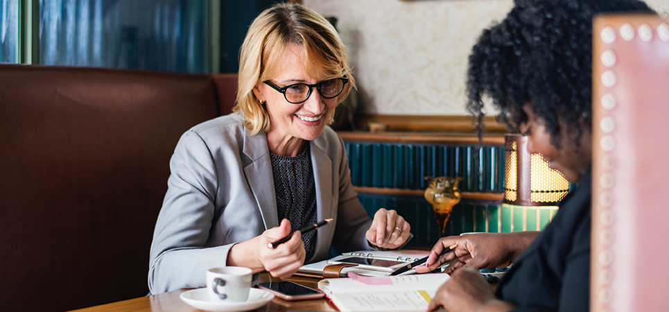 attorney and client reviewing documents